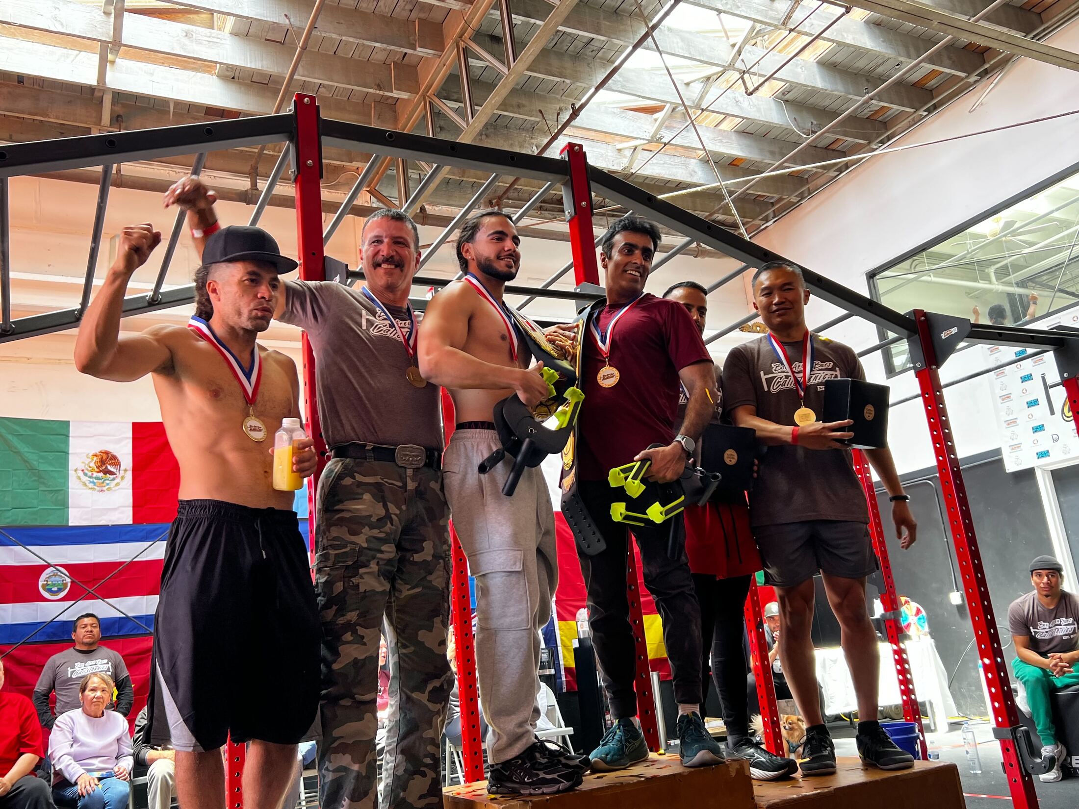 Calisthenics Games Volume V podium winners with their medals and championship belt